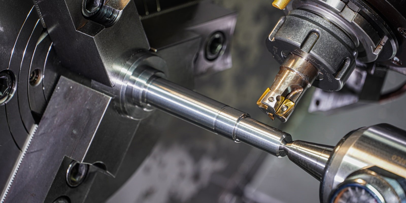 CNC machining center turning a precision steel shaft