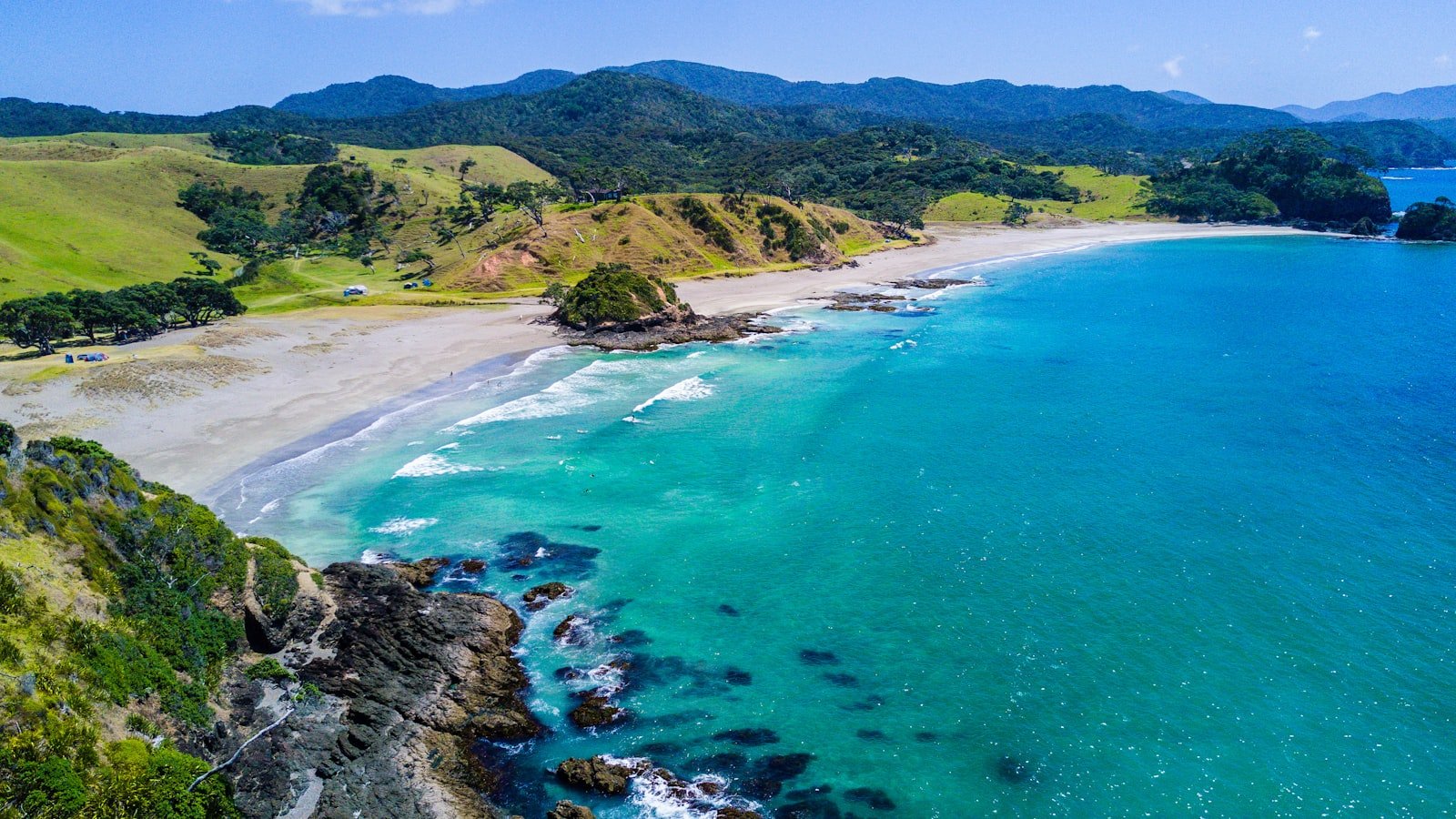 Aerial drone survey view of a coastline with turquoise water